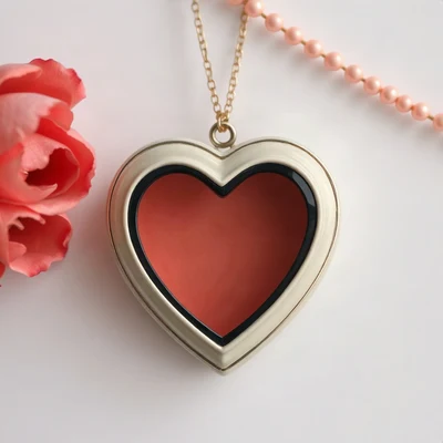 coquette pfp — heart-shaped locket, ivory and soft red, gentle film grain