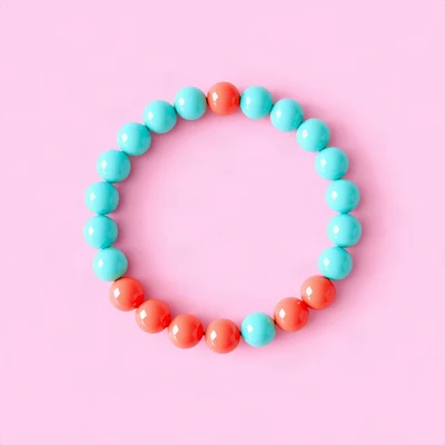 preppy pfp — beaded bracelet circle, aqua and coral, wavy checker border hint