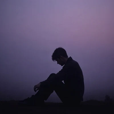 sad pfp — silhouette sitting with knees up, desaturated violet dusk, drifting mist